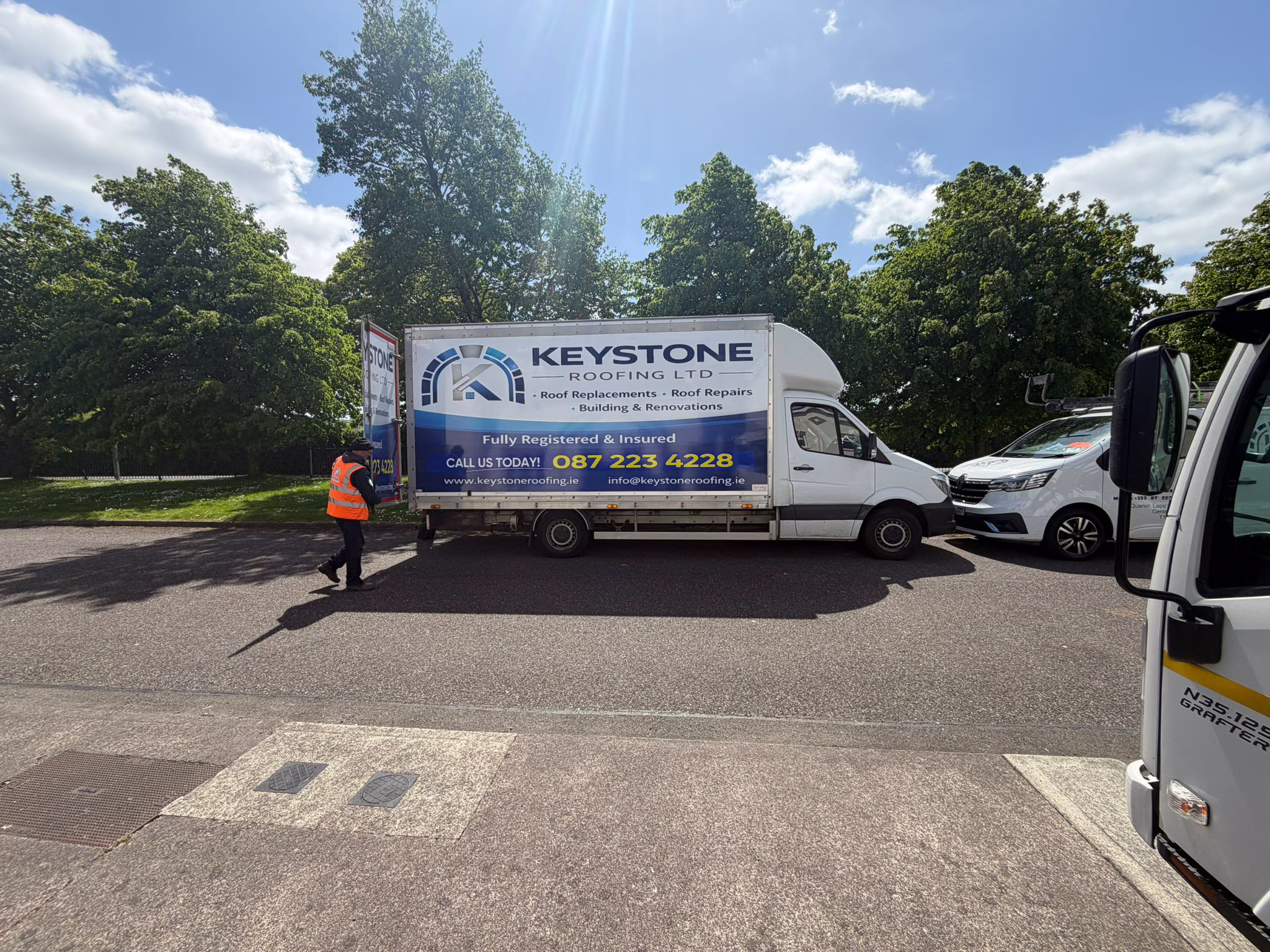 Keystone Roofing Luton box truck with crew member on a Cork job site