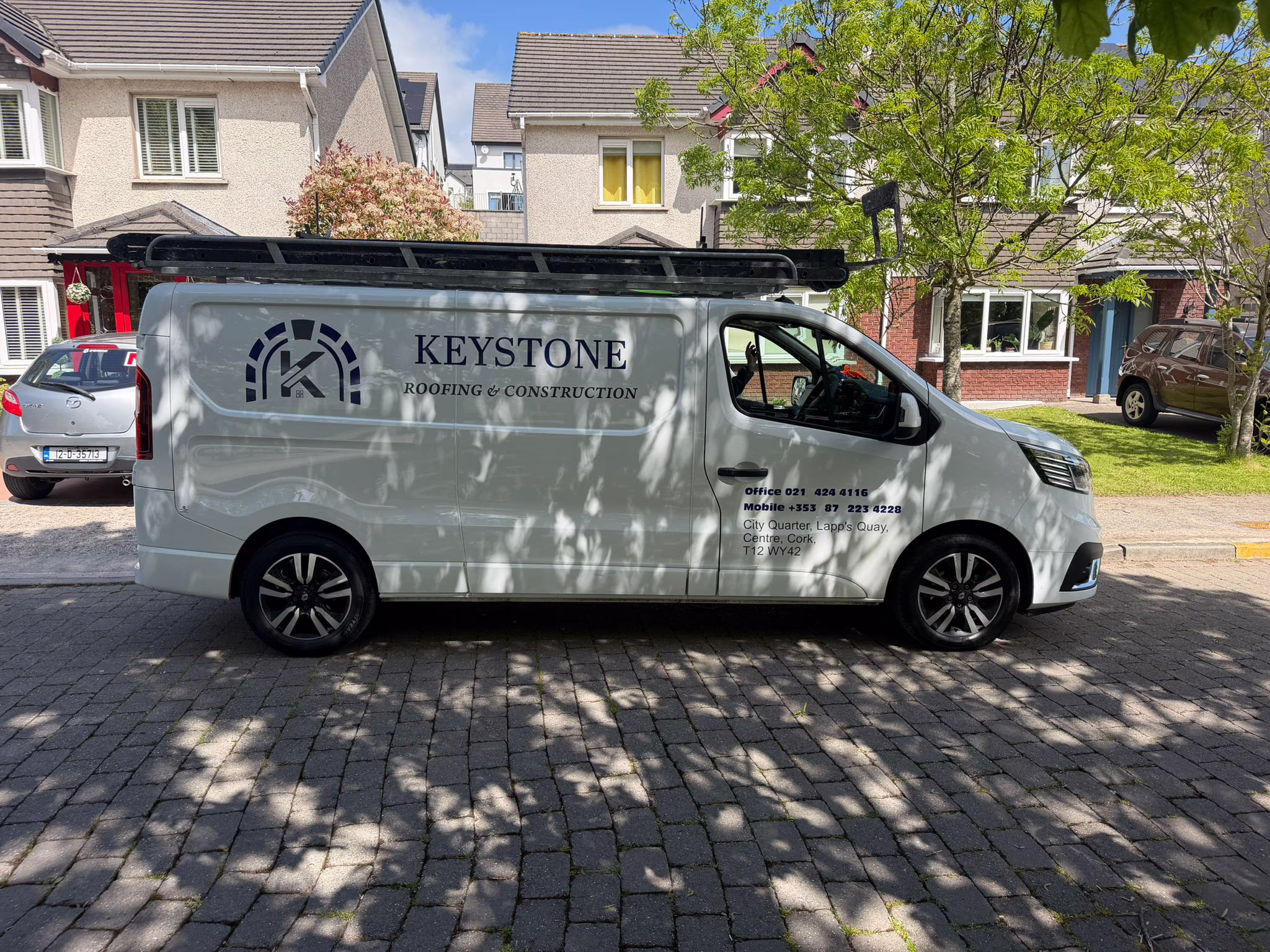 Keystone Roofing & Construction branded van parked on a Cork residential street